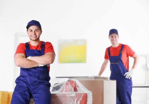 Student removals team handling boxes near Docklands apartment buildings