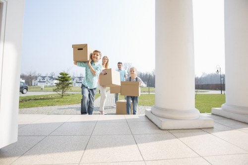 Furniture and boxes being loaded carefully during a house removal