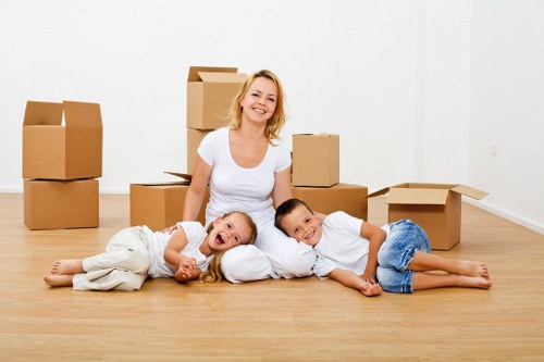 Packed moving boxes and furniture ready for transport in Docklands