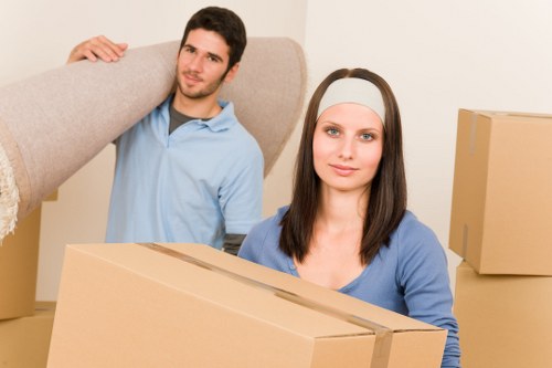 Docklands moving team handling boxes and furniture in East London